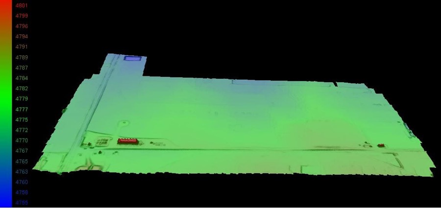 A drone-derived elevation surface model of a well pad, coloured by elevation with a height legend